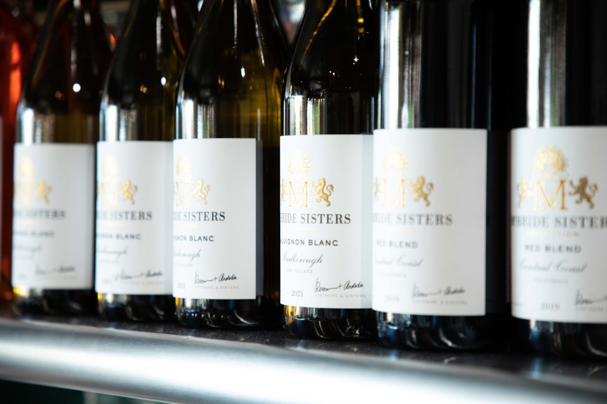 Lined up bottles of white wine, closeup